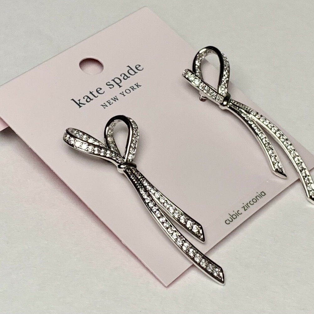 Kate Spade "All Tied Up" Pave Drop Silver Tone Earrings NWT W Storage Pouch.